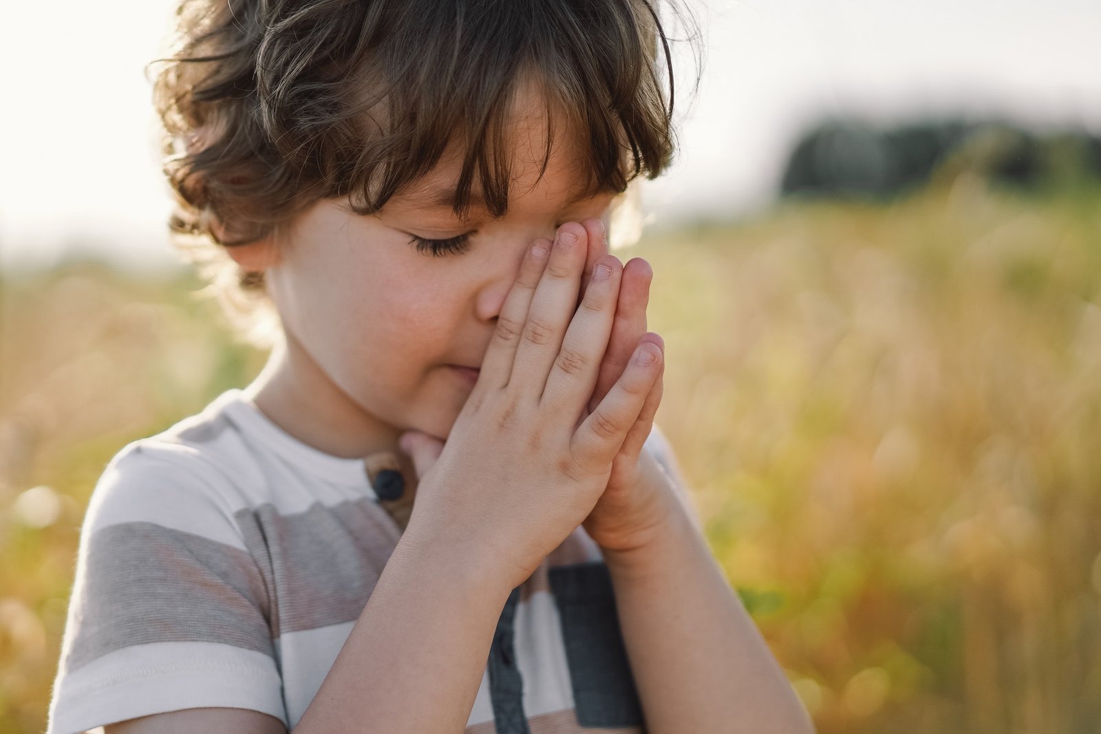 little boy praying and preparing to Testify Jesus